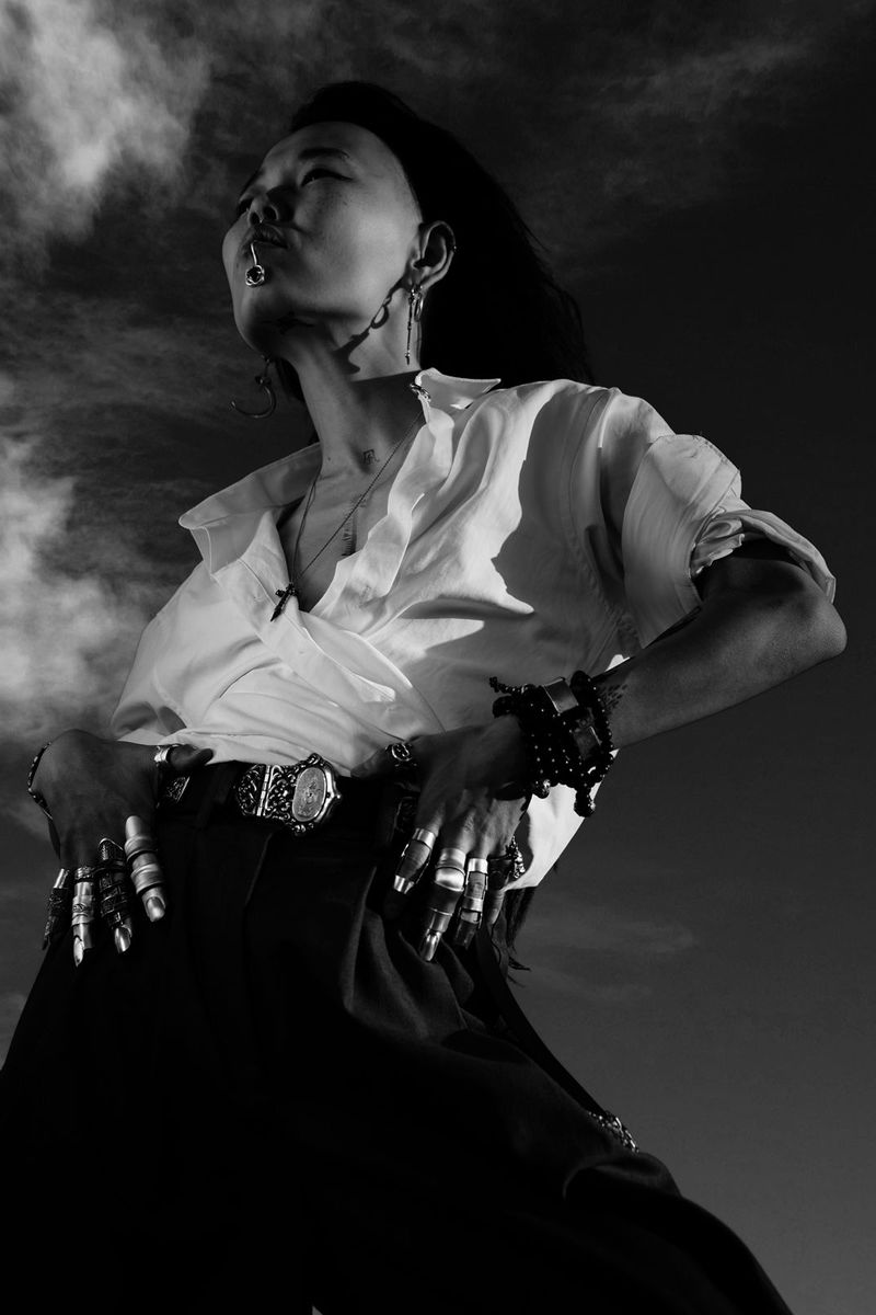 Mariia Khasoeva with silver armour jewelry